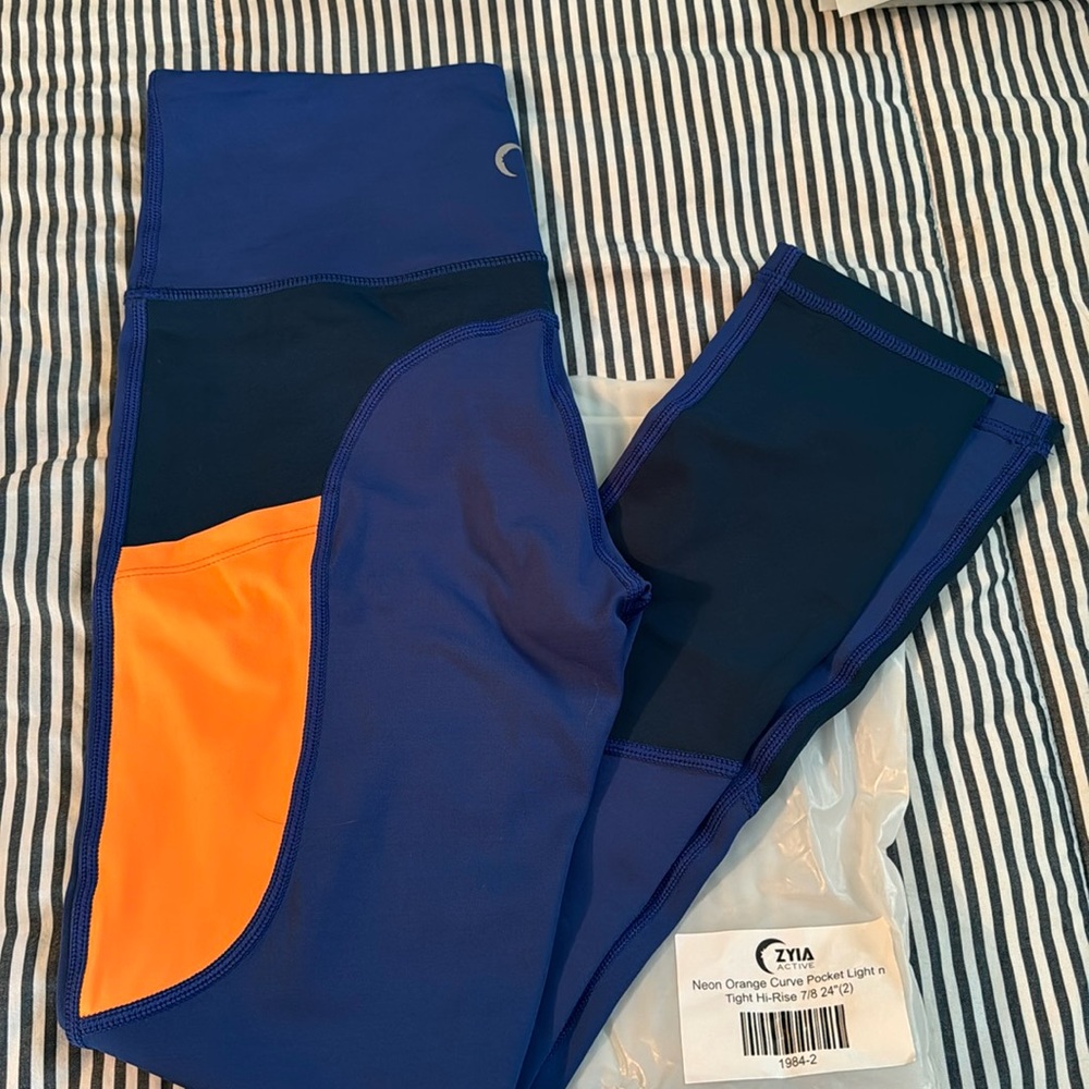 ZYIA Neon Orange Curve Pocket Light N Tight 24” leggings